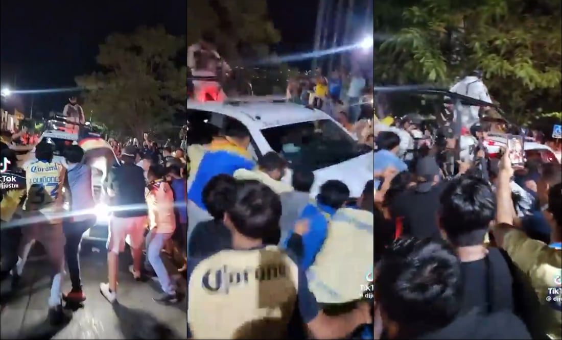 Aficionados del América sacuden la camioneta de la Guardia Nacional durante los festejos del América. FOTOS: Capturas