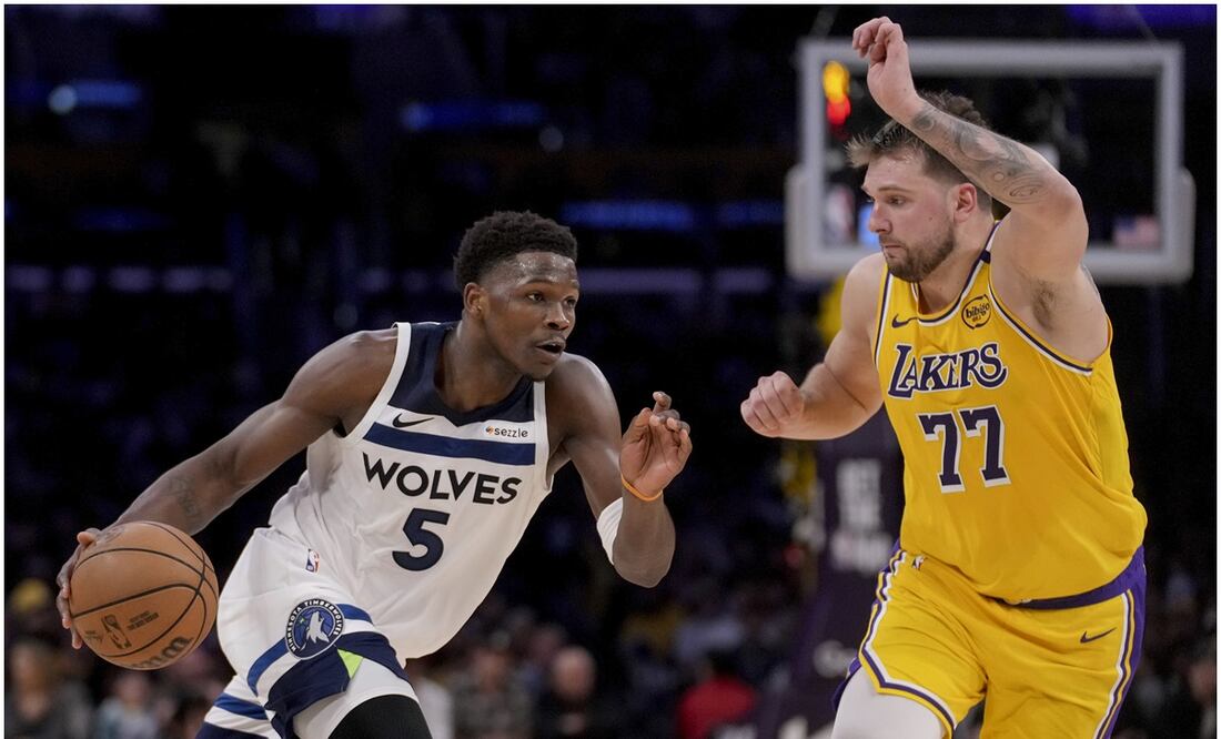 Anthony Edwards y Luka Doncic Foto:AP